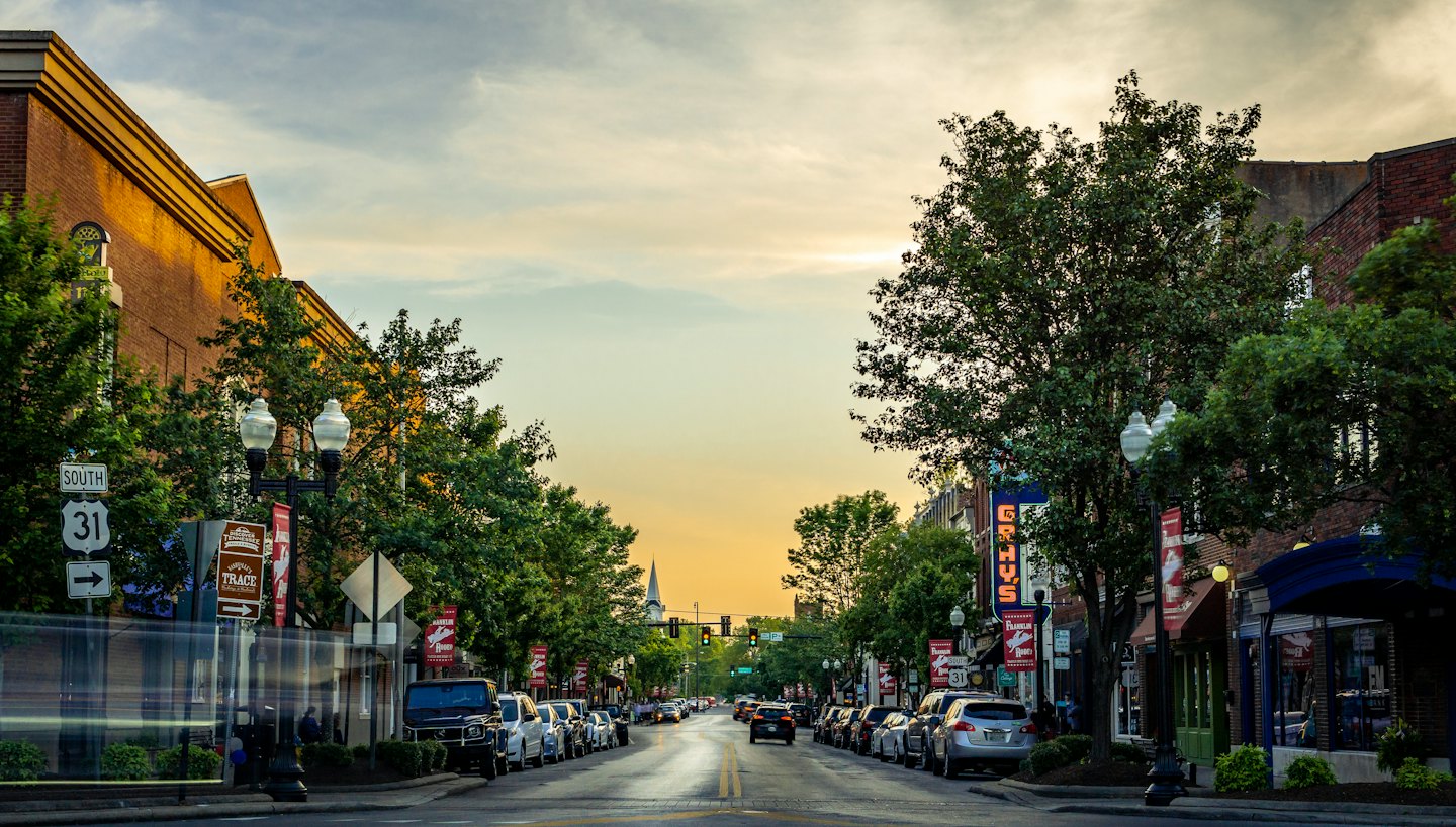 Main street in a small town during golden hour.